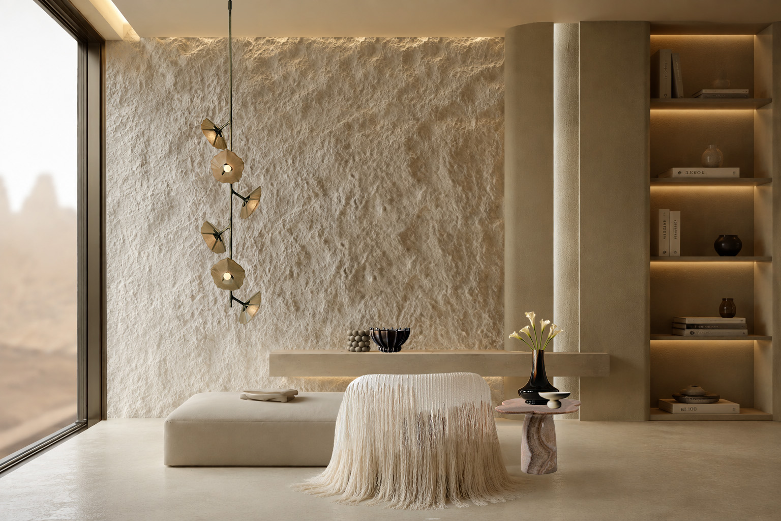 A Kain interior: a sculpted plaster wall, a fringed chair and a bronze pendant in soft evening light